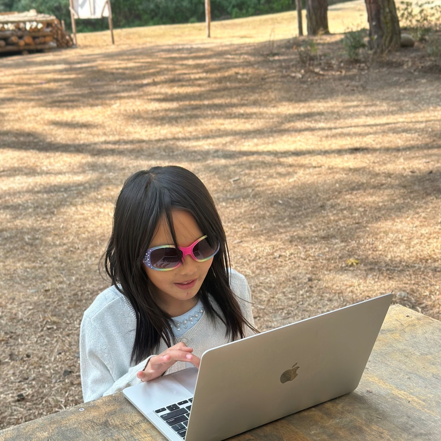 Image of kid girl playing laptop